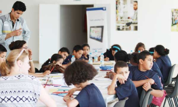The children of "L'Heure Joyeuse" on a summer camp in the city of the Strait